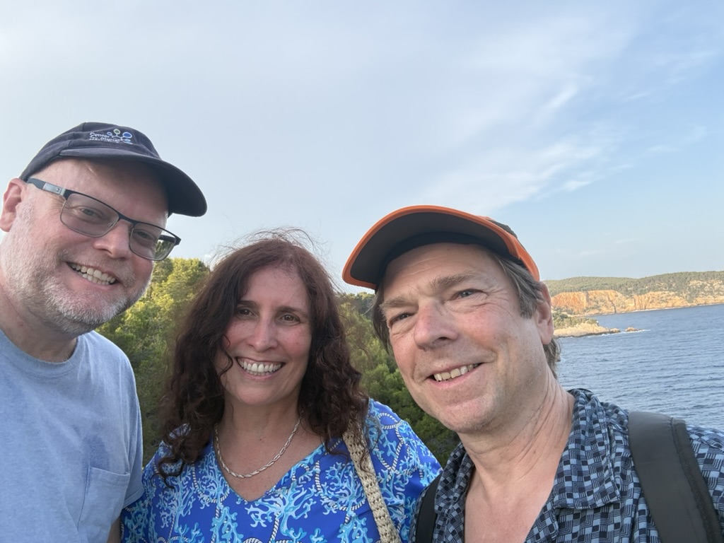 Scott Rettberg, Caitlin Fisher, and Rod Coover together by the coast during a Grand Hotels project workshop.